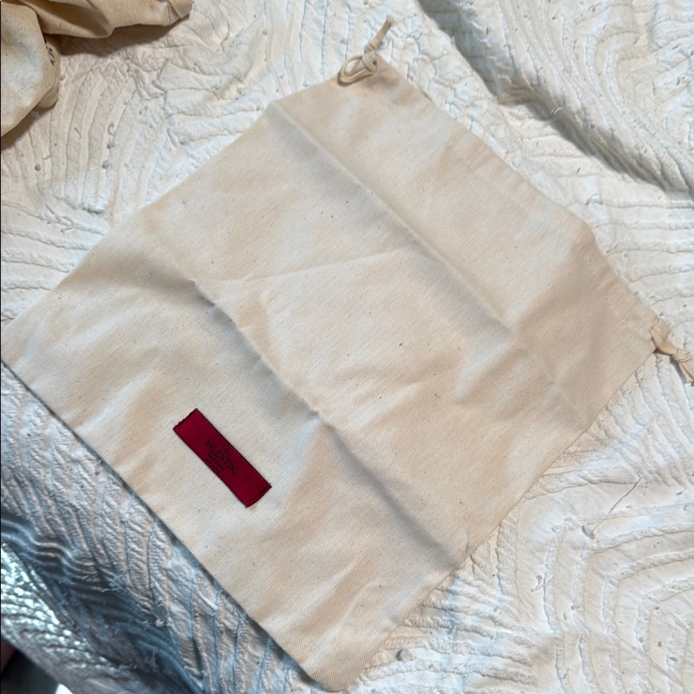 Cream Drawstring Pouch with Red Tag